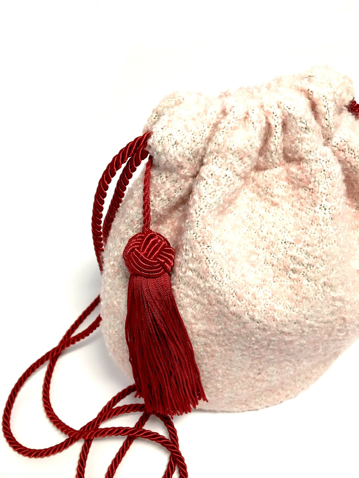 Pink woolen purse with tassel