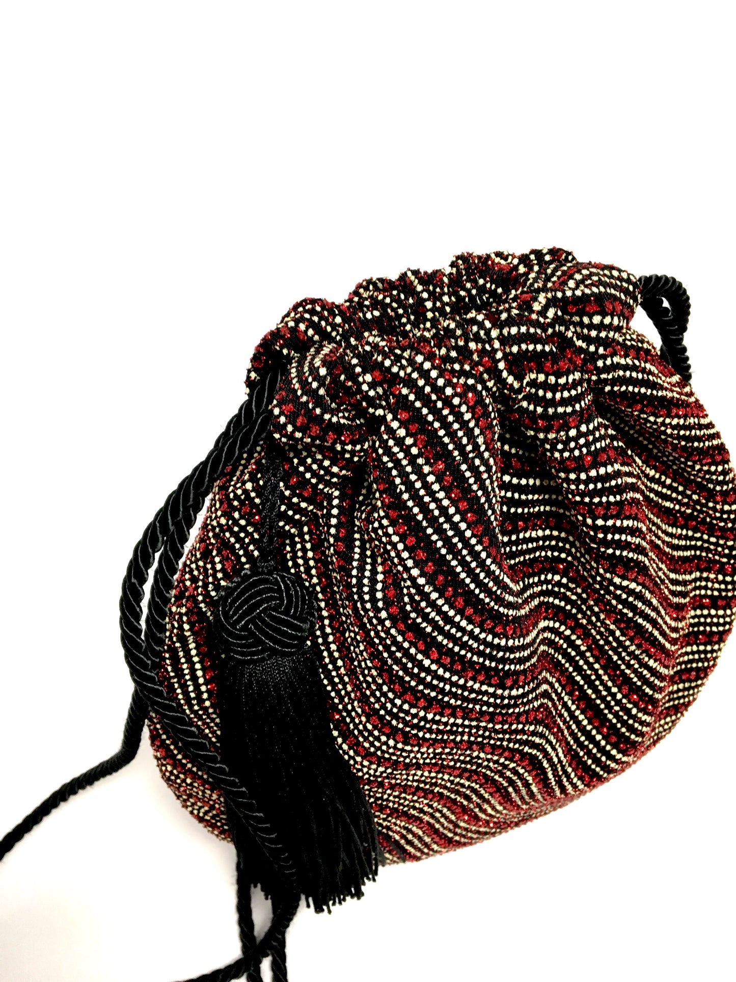 Shiny evening bag with tassel