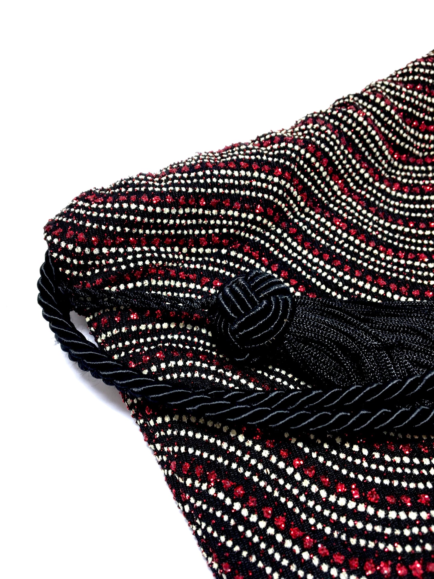 Shiny evening bag with tassel
