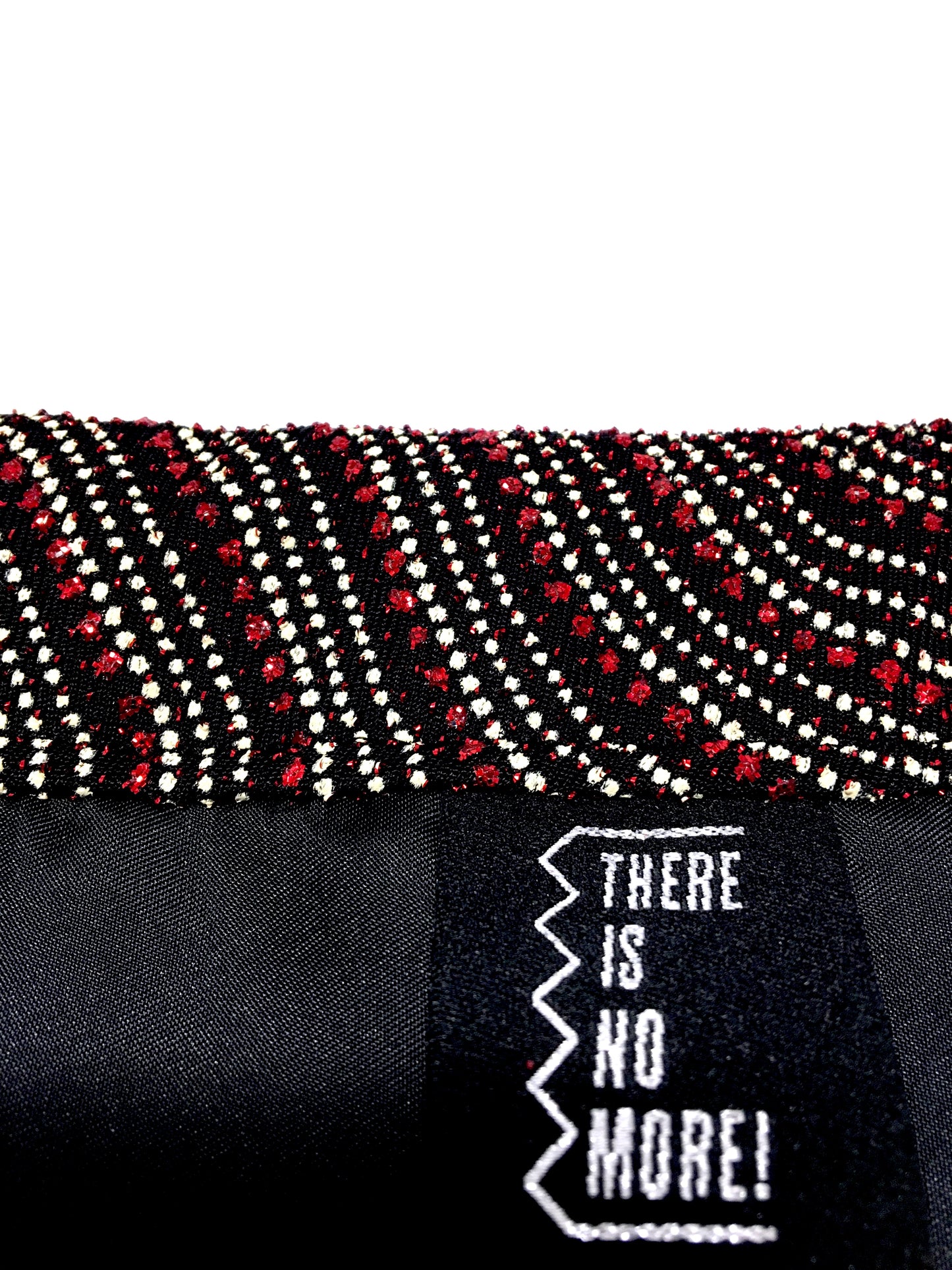 Shiny evening bag with tassel