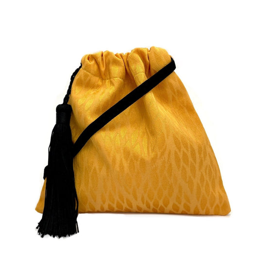 Little yellow handbag with tassel