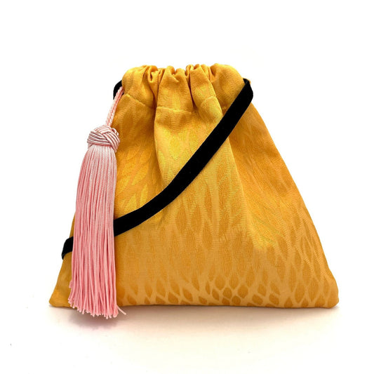 Little yellow handbag with tassel