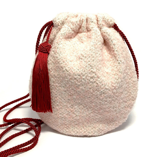 Pink woolen purse with tassel