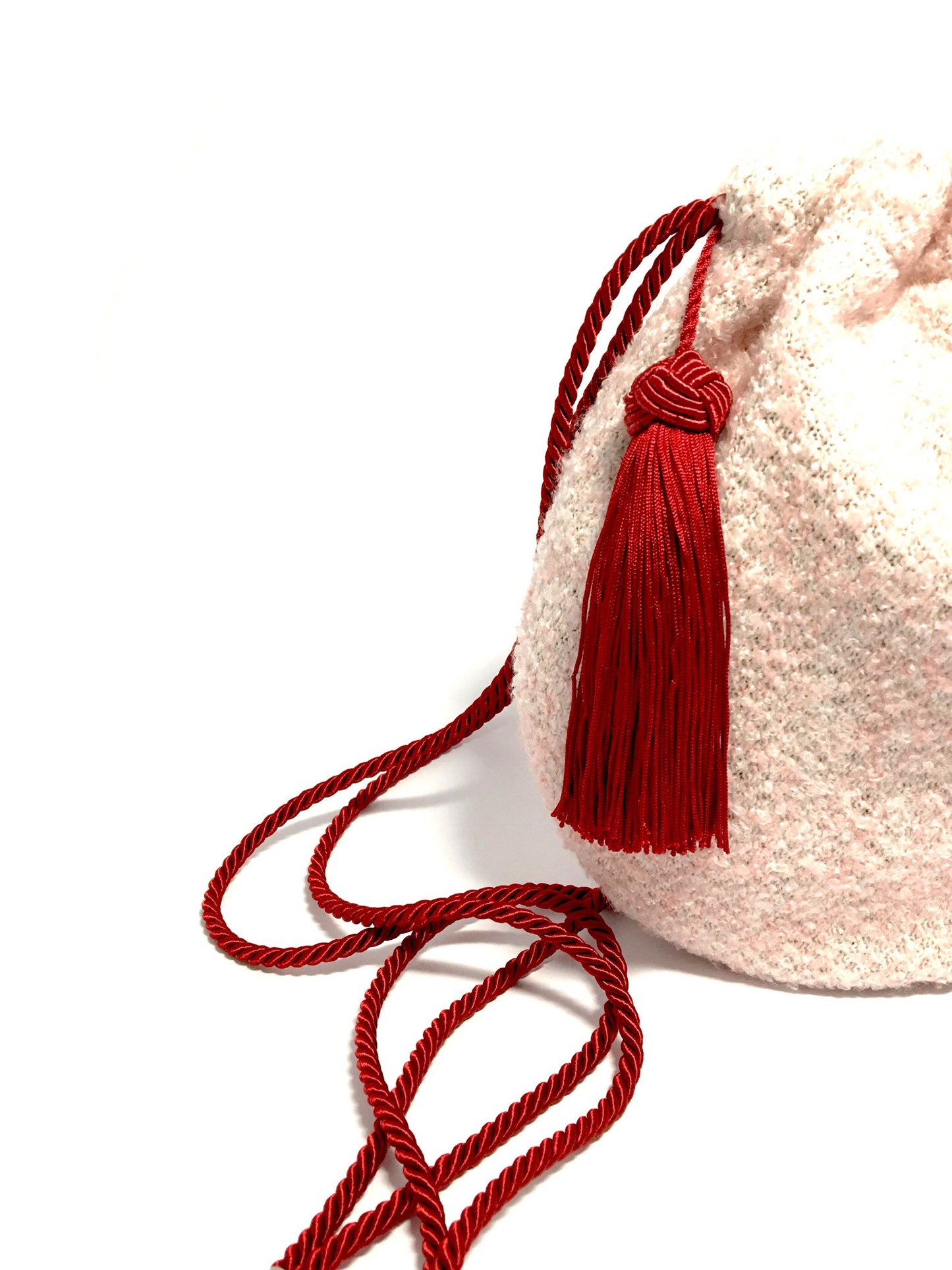 Pink woolen purse with tassel