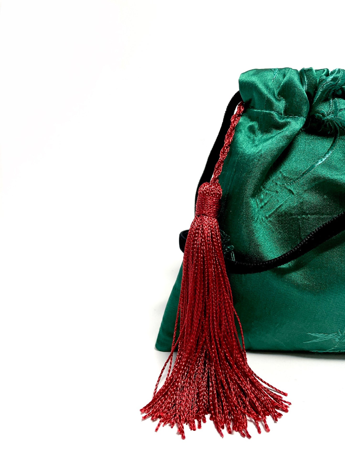 Green little handbag with red tassel