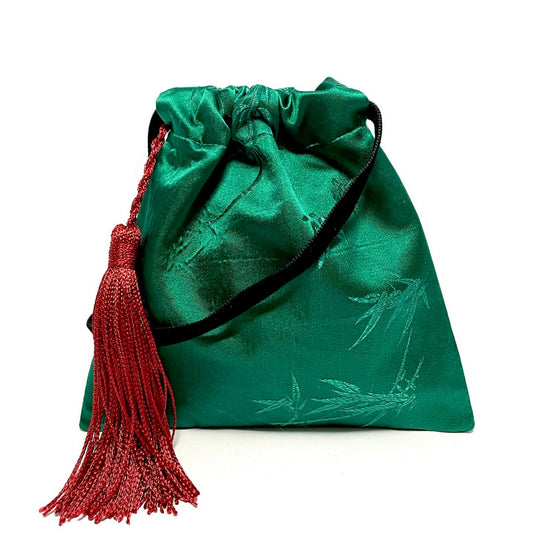 Green little handbag with red tassel